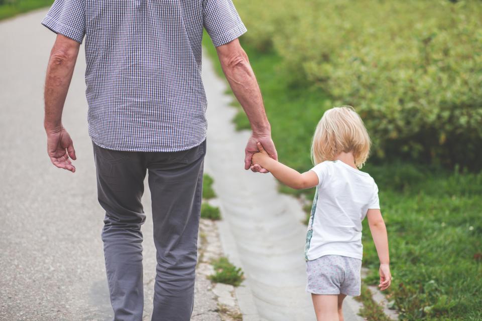 Man walking with his young daughter