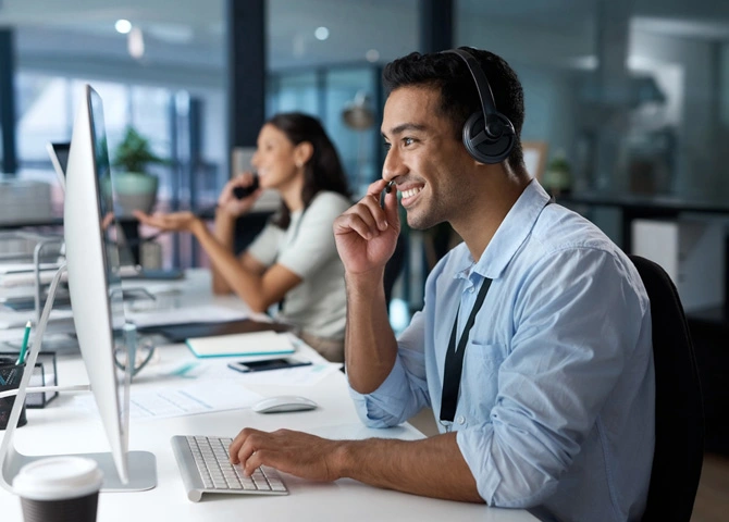 Customer support professionals provide assistance over phone and computer